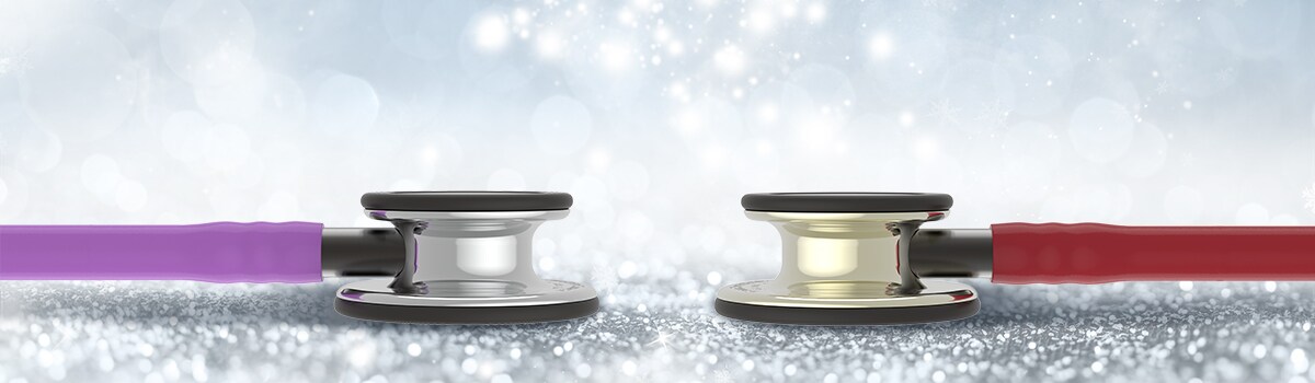 Two Classic III stethoscopes in new Mirror and Champagne chestpiece finishes on a sparkly background
